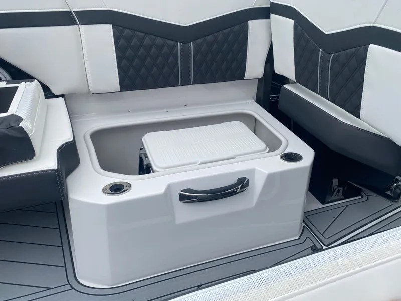 Slide: The Image of 2025 Monterey 278 Super Sport boat interior with built-in storage compartment and stylish seating. - 10