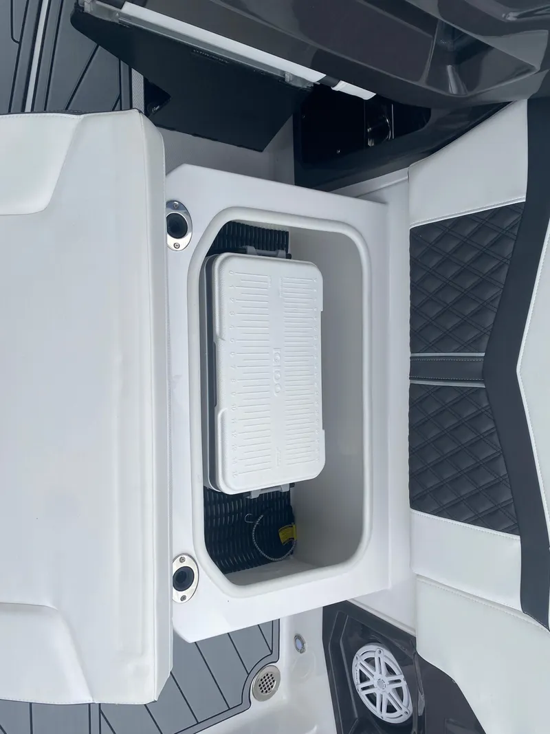 Slide: The Image of 2025 Monterey 278 Super Sport boat interior with built-in storage compartment. - 11