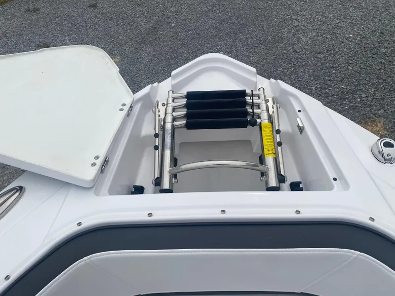 Slide: The Image of 2025 Monterey 278 Super Sport boat with open hatch and retractable ladder. - 29