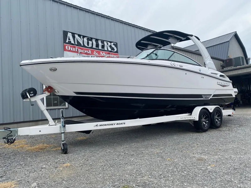 Slide: The Image of 2025 Monterey 278 Super Sport boat on trailer outside Anglers Outpost & Marine. - 4