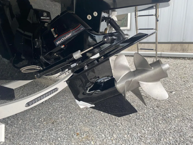 Slide: The Image of 2025 Monterey 278 Super Sport boat propeller and outdrive on gravel surface. - 6