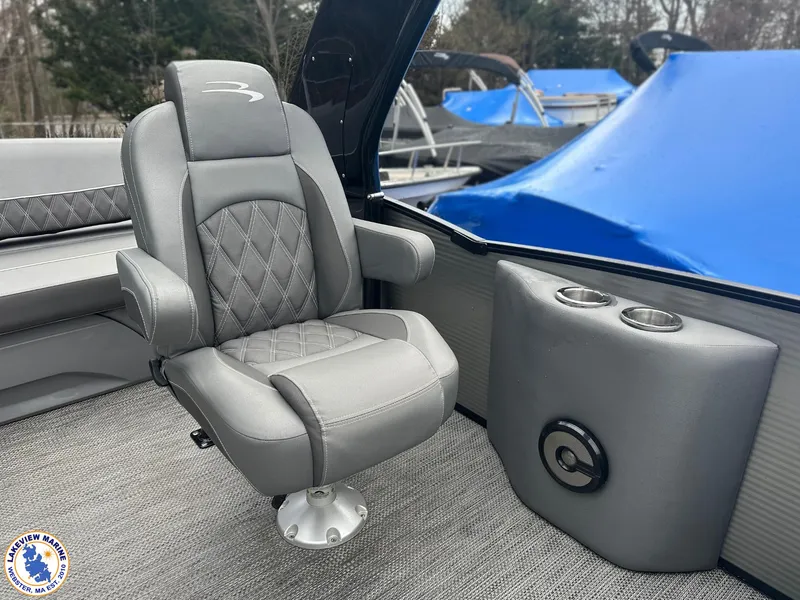 Slide: The Image of Luxury seating on 2020 Bennington R 25 RSBA pontoon boat, featuring gray upholstery and cup holders. - 11