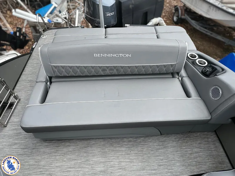 Slide: The Image of 2020 Bennington R 25 RSBA boat seat with gray upholstery and cup holders. - 12