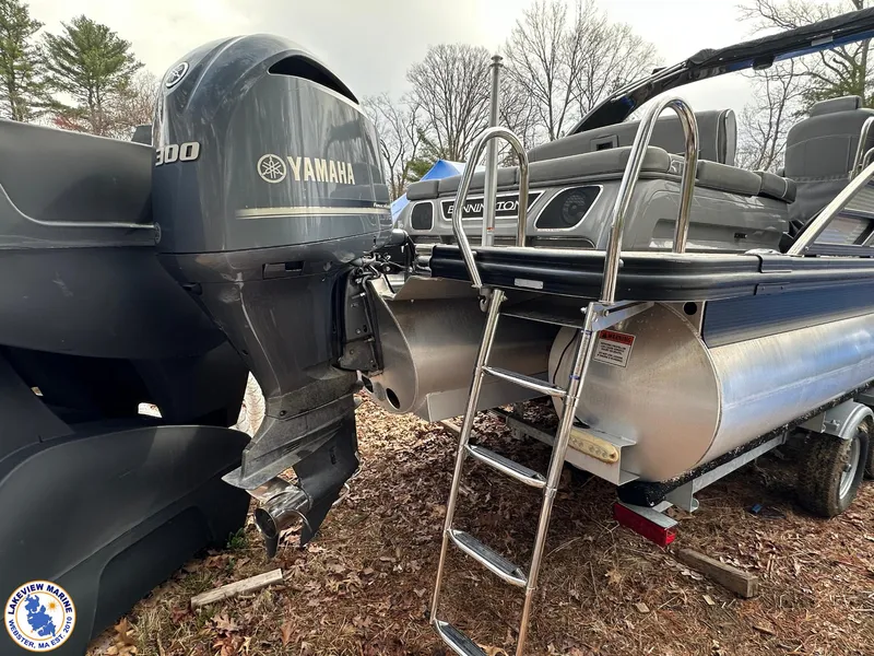 Slide: The Image of 2020 Bennington R 25 RSBA pontoon boat with Yamaha 300 engine, parked on a trailer. - 3