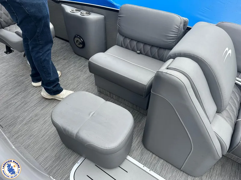 Slide: The Image of 2020 Bennington R 25 RSBA boat interior with gray seating and carpeted floor. - 7