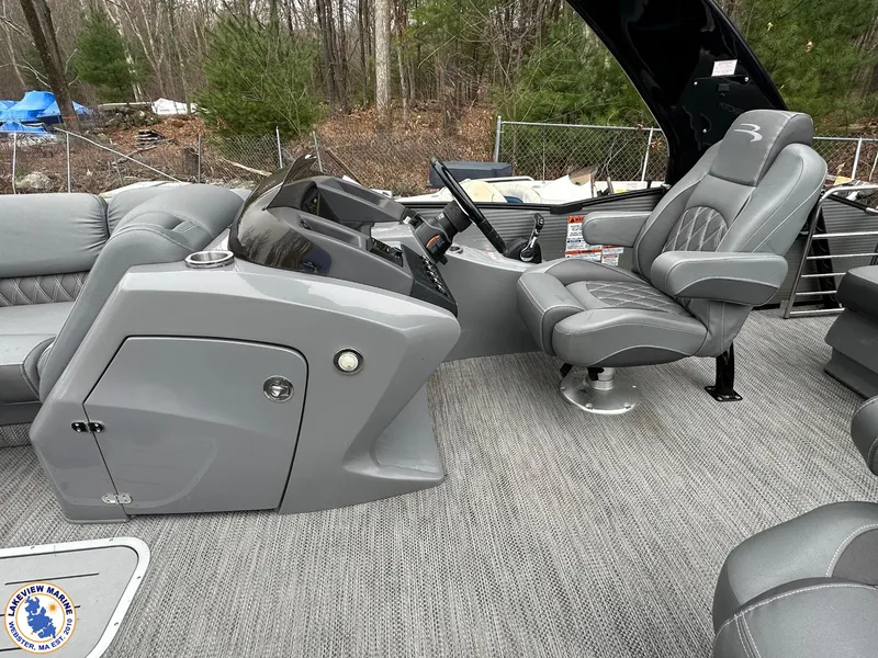Slide: The Image of 2020 Bennington R 25 RSBA boat interior with gray seating and control console. - 8