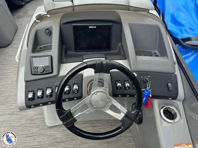 Slide: The Image of 2020 Bennington R 25 RSBA boat dashboard with steering wheel and control panel. - 9