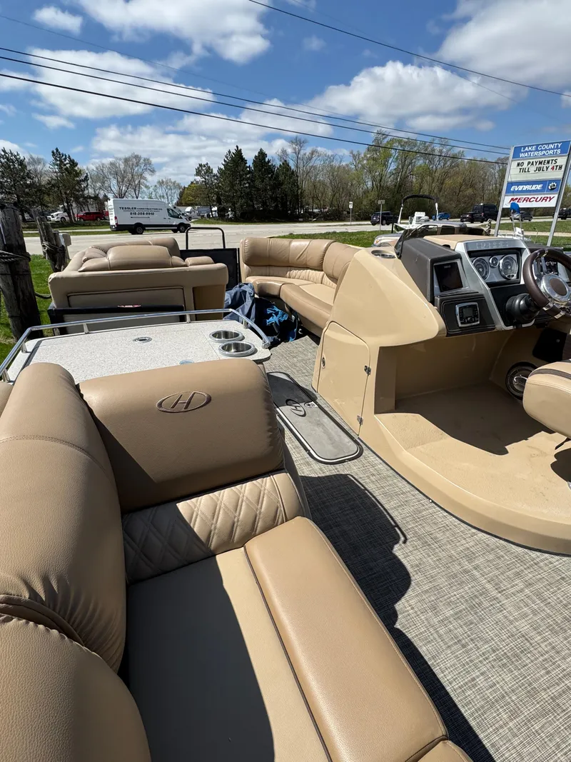 Slide: The Image of 2018 Harris Grand Mariner 230 pontoon boat with beige seating and modern dashboard. - 15