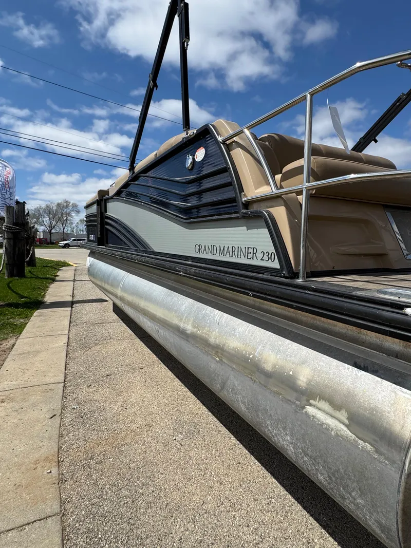 Slide: The Image of 2018 Harris Grand Mariner 230 pontoon boat on a sunny day, side view. - 5
