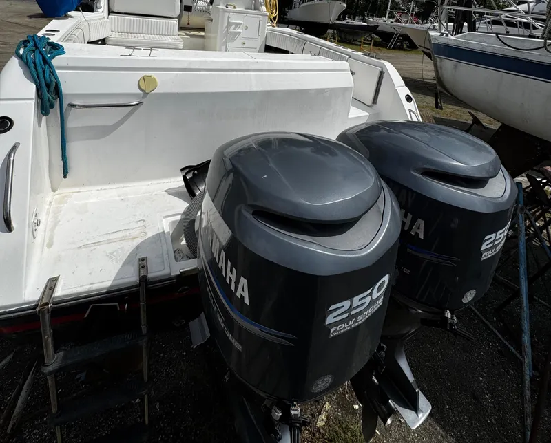 Slide: The Image of 2001 Stamas 310 Express boat with twin Yamaha 250 outboard engines. - 11