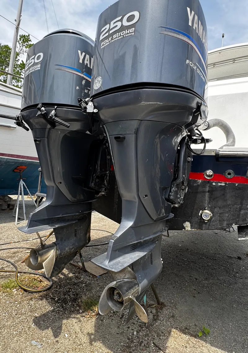 Slide: The Image of Twin Yamaha 250 outboard motors on a 2001 Stamas 310 Express boat. - 14