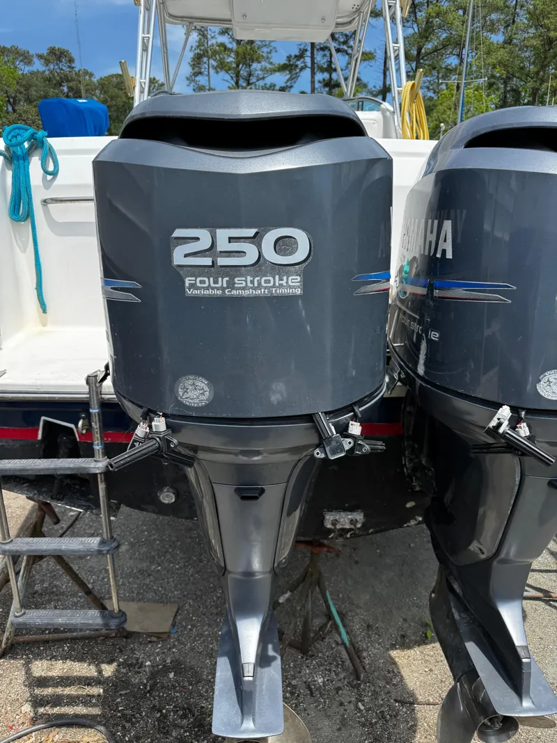 Slide: The Image of 2001 Stamas 310 Express with twin Yamaha 250 four-stroke outboard engines. - 15