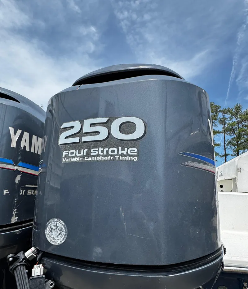 Slide: The Image of Yamaha 250 four-stroke outboard motor on a 2001 Stamas 310 Express boat. - 16