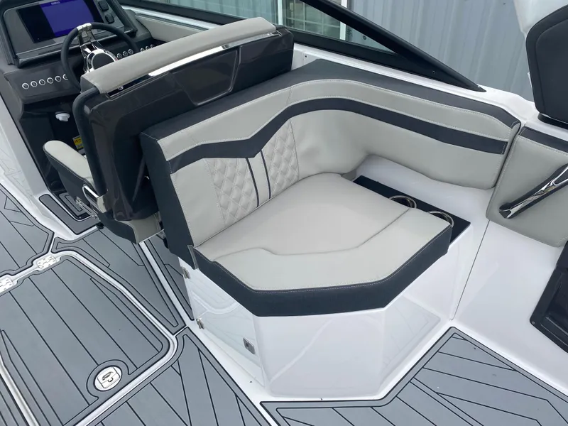 Slide: The Image of 2025 Monterey 258 Super Sport boat interior with sleek seating and modern dashboard design. - 16