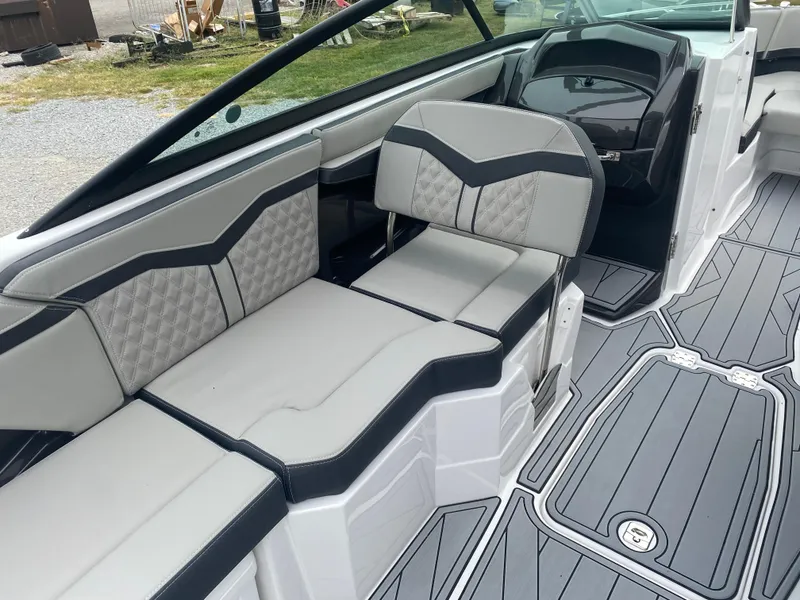 Slide: The Image of 2025 Monterey 258 Super Sport boat interior with sleek seating and modern design. - 18