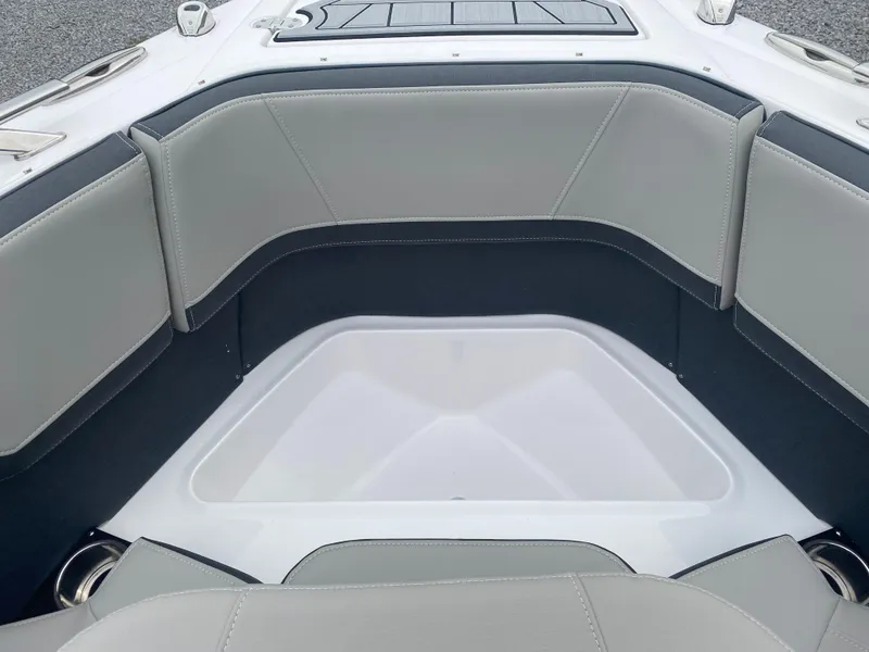 Slide: The Image of 2025 Monterey 258 Super Sport boat interior with gray seating and sleek design. - 29