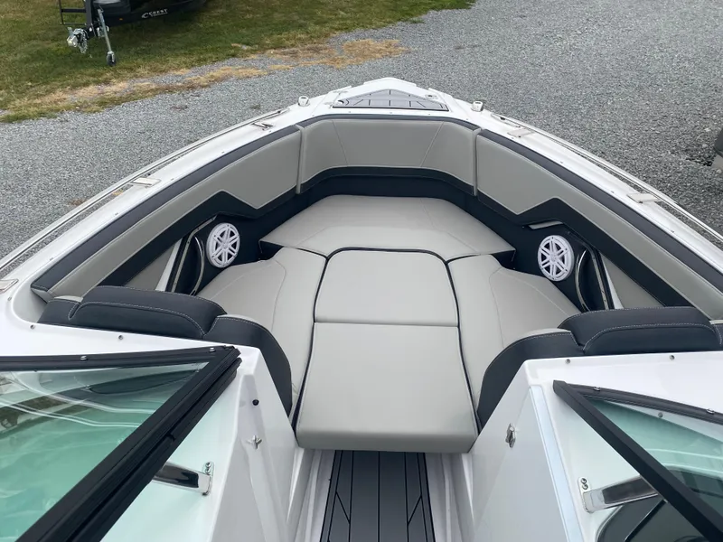 Slide: The Image of 2025 Monterey 258 Super Sport boat interior with cushioned seating and speakers. - 31
