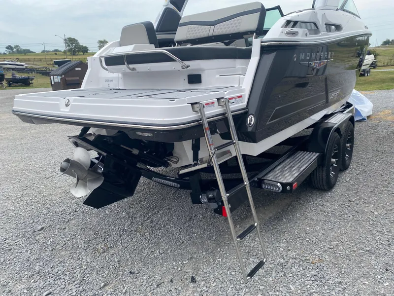 Slide: The Image of 2025 Monterey 258 Super Sport boat on trailer with ladder, rear view. - 9