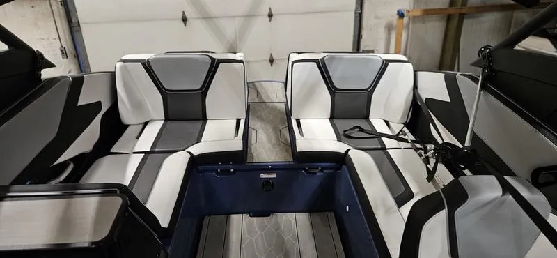 Slide: The Image of 2023 Yamaha Boats 255XD interior with sleek black and white seating design. - 6