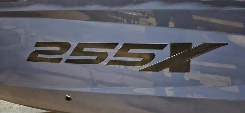 Slide: The Image of Yamaha Boats 2023 model 255XD logo on sleek boat surface. - 7