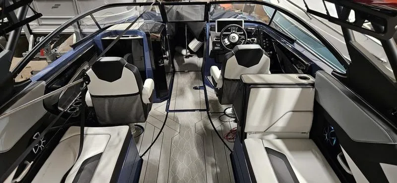 Slide: The Image of 2023 Yamaha Boats 255XD interior with modern seating and sleek design. - 9