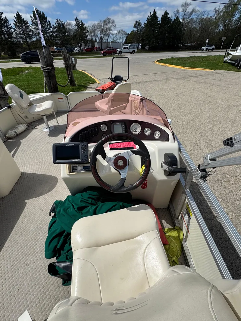 Slide: The Image of 2007 Bennington 2050 FSI boat interior with steering wheel and dashboard controls. - 15
