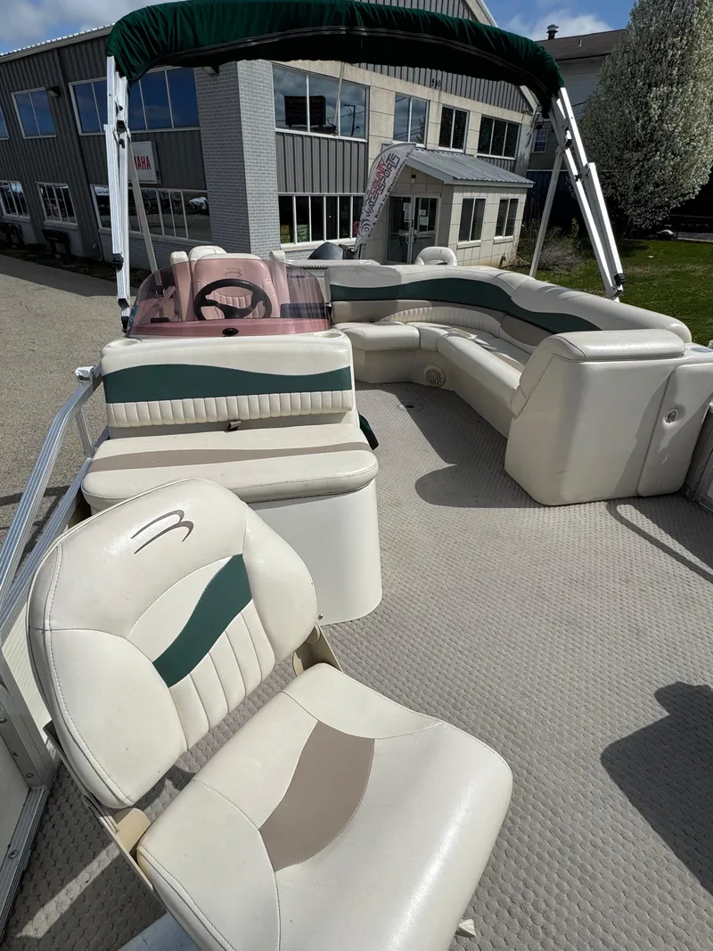 Slide: The Image of 2007 Bennington 2050 FSI pontoon boat with spacious seating and canopy. - 21