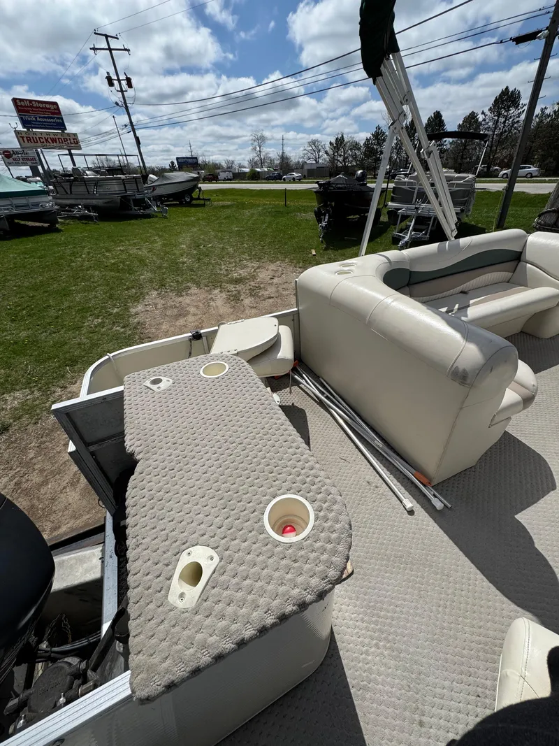 Slide: The Image of 2007 Bennington 2050 FSI pontoon boat interior with seating and fishing setup. - 30