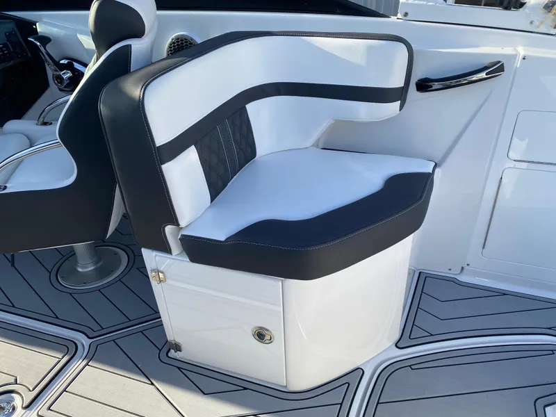 Slide: The Image of 2025 Monterey M6 boat interior with sleek black and white seating design. - 13