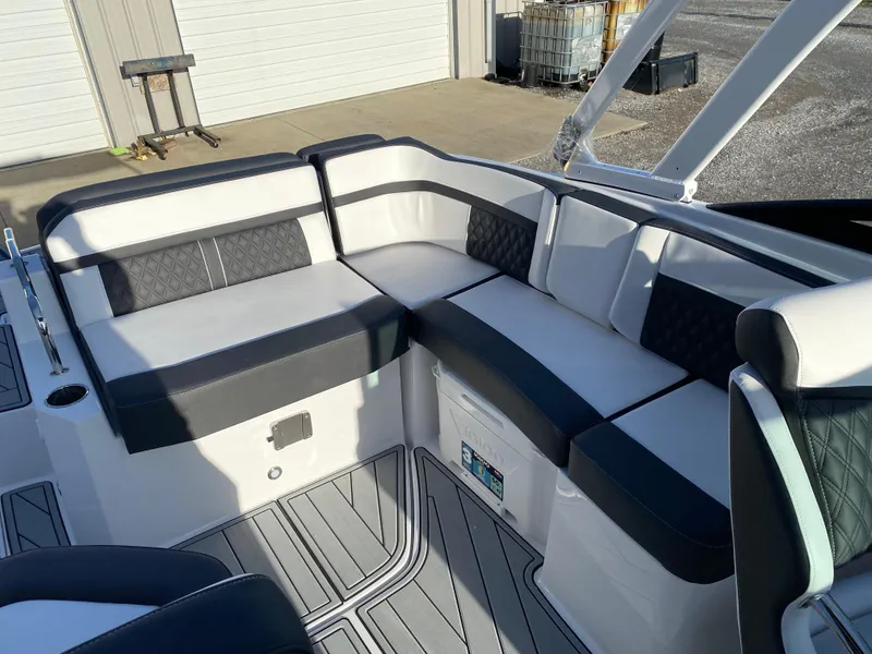 Slide: The Image of 2025 Monterey M6 boat interior with sleek, modern seating and stylish design. - 14