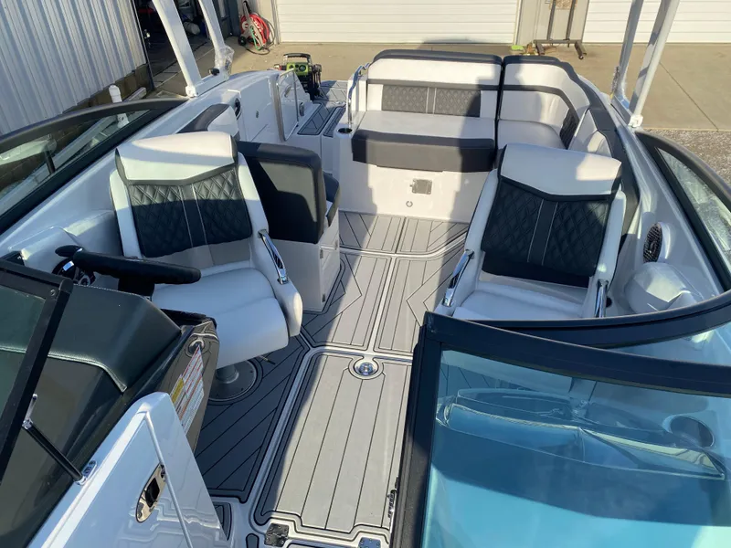 Slide: The Image of 2025 Monterey M6 boat interior with modern seating and sleek design. - 22