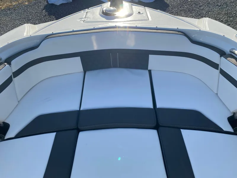 Slide: The Image of 2025 Monterey M6 boat interior with sleek white and black seating design. - 26