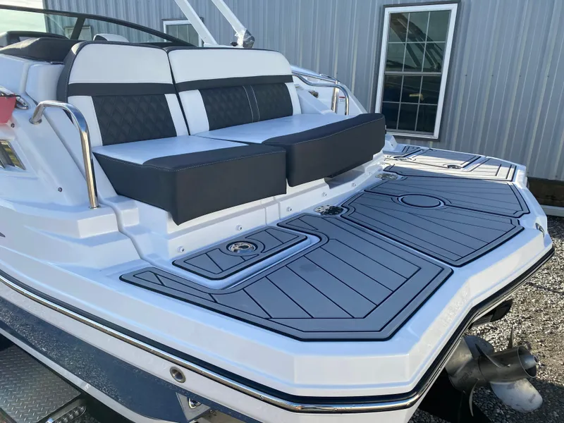 Slide: The Image of 2025 Monterey M6 boat with sleek seating and modern deck design. - 6