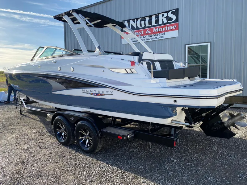 Slide: The Image of 2025 Monterey M6 boat on trailer outside Anglers Port Marine building. - 8