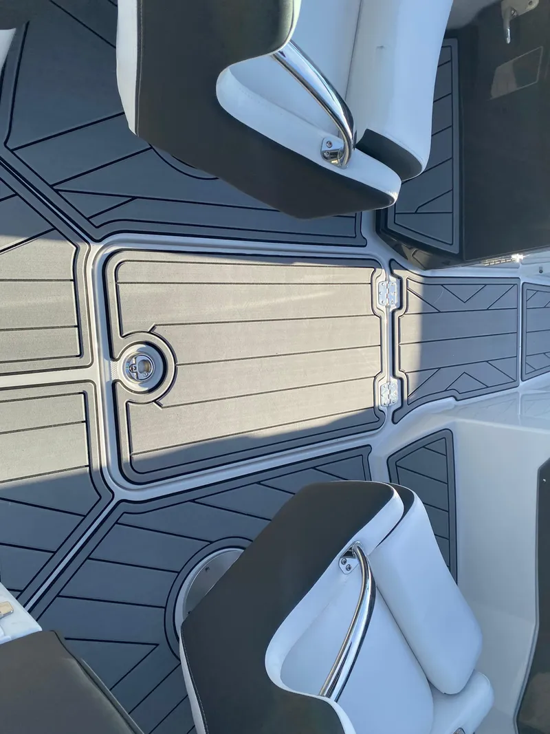 Slide: The Image of 2025 Monterey M6 boat interior with sleek seating and modern flooring design. - 9