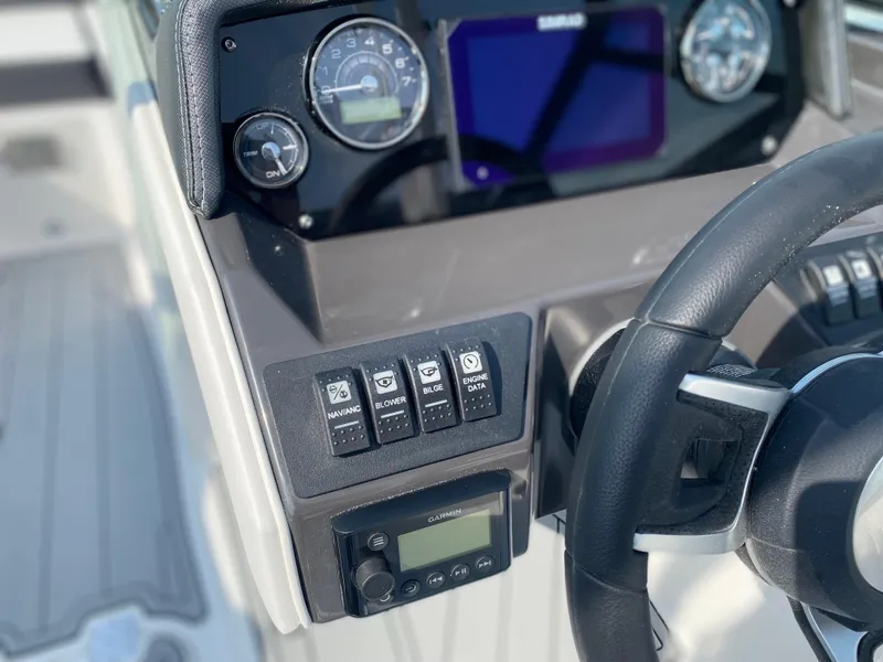 Slide: The Image of Dashboard of 2025 Monterey M-22 boat with steering wheel and control panel. - 10