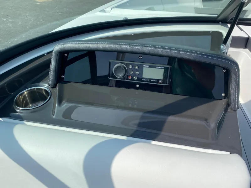 Slide: The Image of Dashboard of 2025 Monterey M-22 boat with control panel and cup holder. - 11