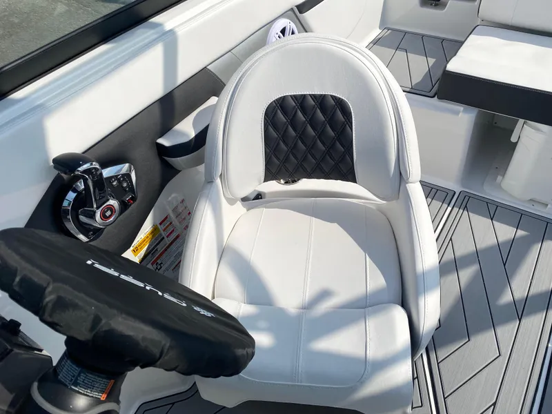 Slide: The Image of Captain's seat in 2025 Monterey M-22 boat, featuring sleek design and modern controls. - 18