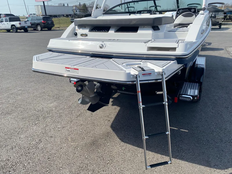 Slide: The Image of 2025 Monterey M-22 boat rear view with swim platform and ladder. - 6