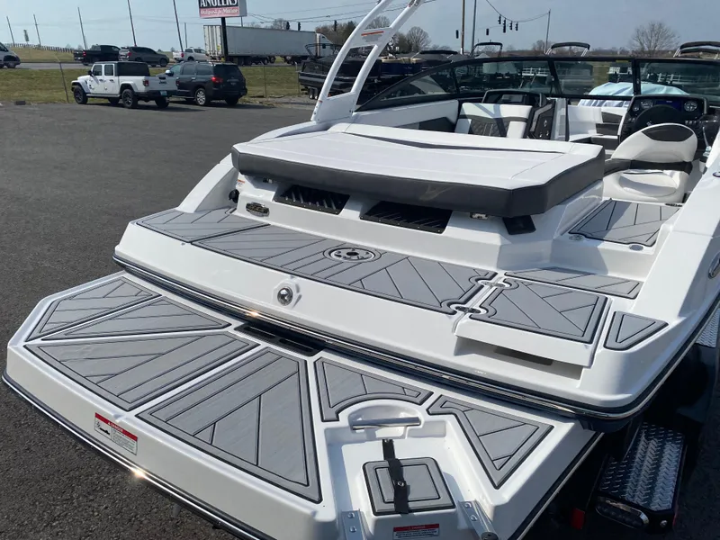 Slide: The Image of 2025 Monterey M-22 boat with sleek design and spacious seating on display. - 7