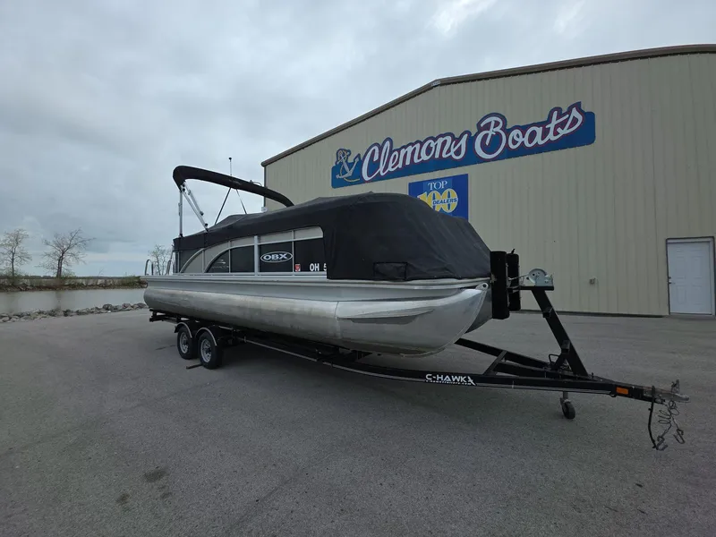 Slide: The Image of 2013 Bennington 24 SSLX pontoon boat on trailer at Clemons Boats dealership. - 5