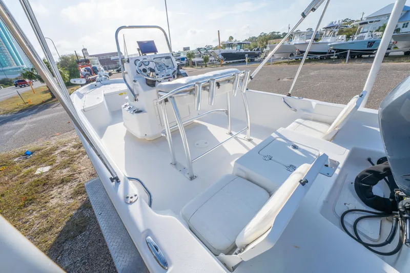 Slide: The Image of 2011 NauticStar 2110 Nautic Bay boat interior with seating and steering console. - 11