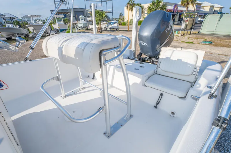 Slide: The Image of 2011 NauticStar 2110 Nautic Bay boat interior with seating and Yamaha outboard motor. - 12