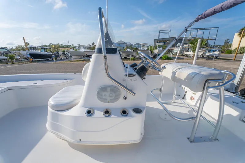 Slide: The Image of 2011 NauticStar 2110 Nautic Bay boat interior with steering console and seating. - 14