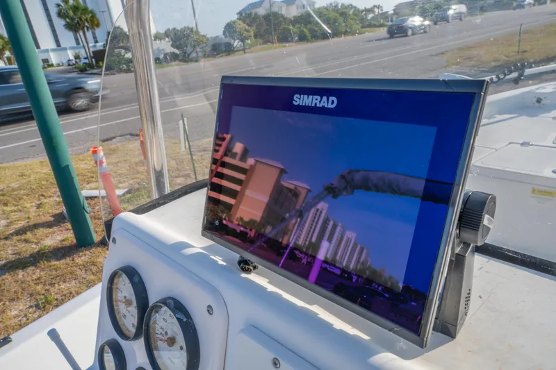 Slide: The Image of Simrad display on 2011 NauticStar 2110 Nautic Bay boat, showing building reflections. - 18