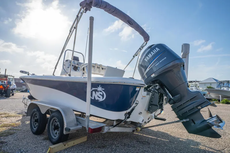 Slide: The Image of 2011 NauticStar 2110 Nautic Bay boat on trailer with Yamaha outboard motor. - 6