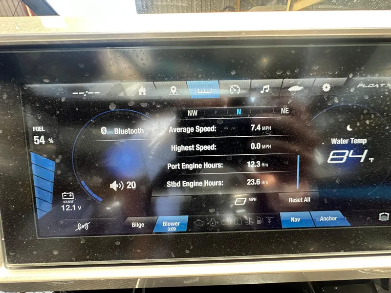 Slide: The Image of Dashboard of 2023 Yamaha Boats 255XD showing speed, engine hours, and water temperature. - 11