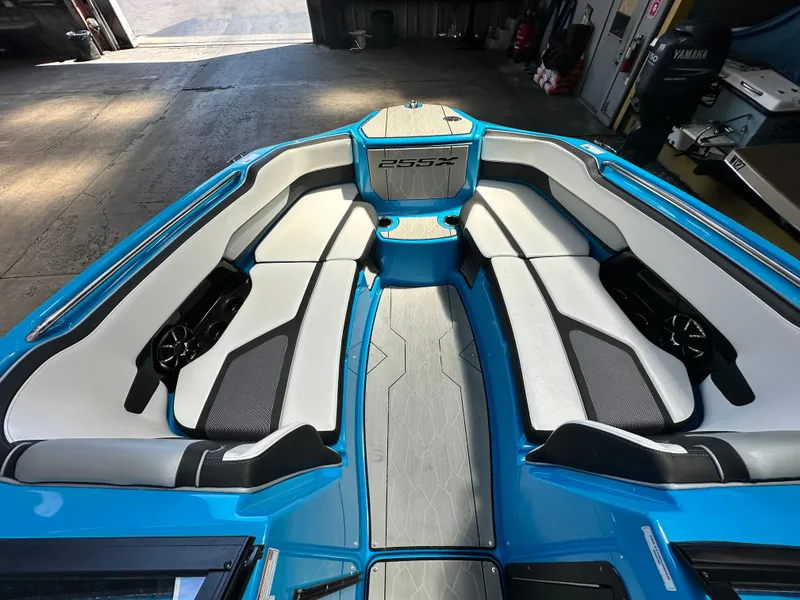 Slide: The Image of 2023 Yamaha Boats 255XD interior with sleek seating and modern design. - 13
