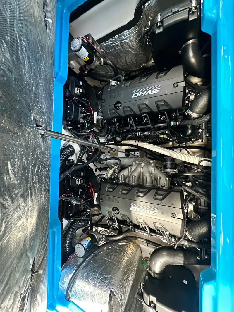 Slide: The Image of 2023 Yamaha Boats 255XD engine compartment showcasing dual engines and advanced components. - 16
