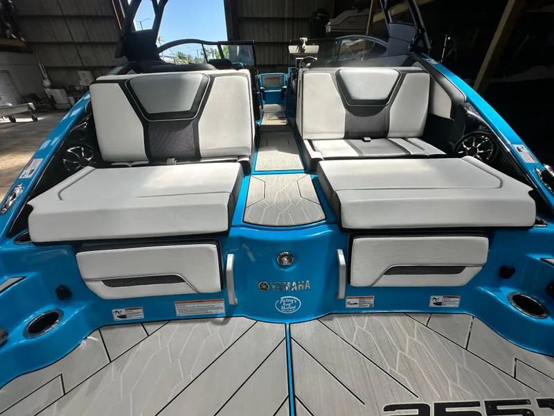 Slide: The Image of 2023 Yamaha Boats 255XD interior with sleek seating and modern design. - 22